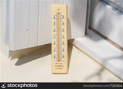 Thermometer on the edge of a window during summer