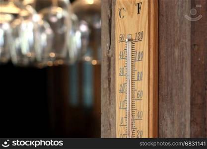 thermometer on wooden wall in restaurant