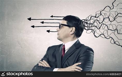 These thoughts in my head. Thoughtful adult businessman with arrows and thoughts coming out of his head