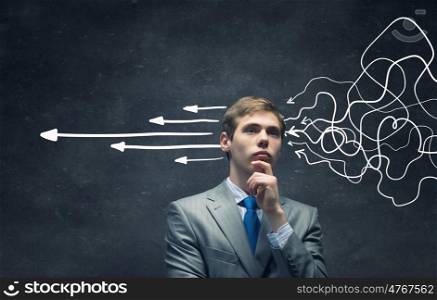 These thoughts in my head. Thoughtful businessman with arrows and thoughts coming out of his head