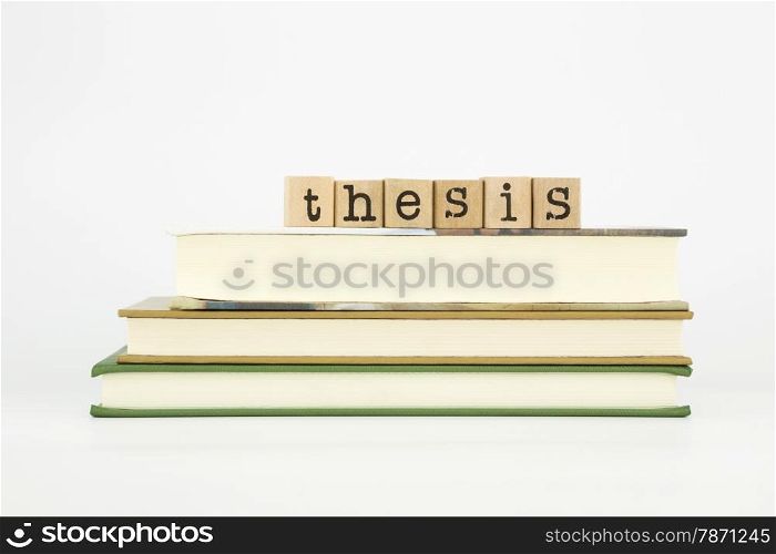 thesis word on wood stamps stack on books