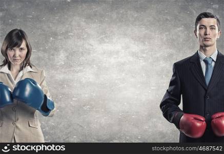 They are ready to fight. Businesswoman and businessman representing partners competition concept