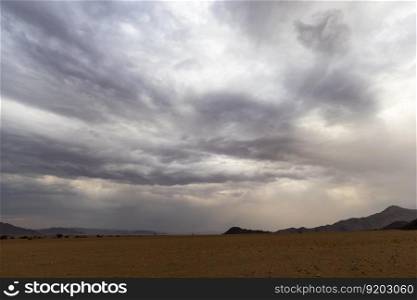 Thick cloud bank over the barren desert