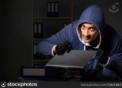 Thief trying to steal personal data in identity theft concept. The thief trying to steal personal data in identity theft concept