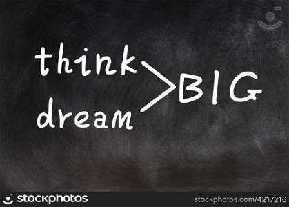 Think and dream big written on a blackboard