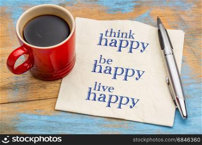 think, be, live happy - handwriting on a napkin with a cup of espresso coffee