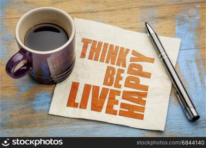 think, be, live happy - word abstract on a napkin with a cup of espresso coffee
