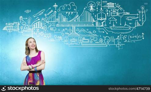Think creative. Woman in multicolored dress against sketch background