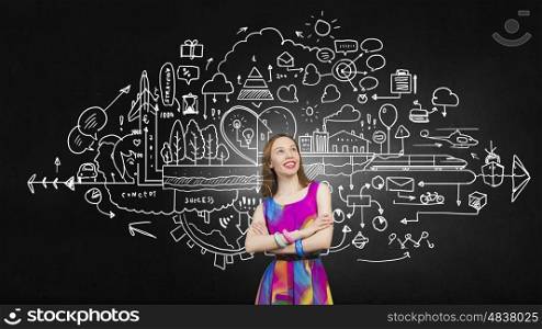 Think creative. Woman in multicolored dress against sketch background