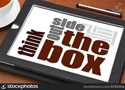 think outside the box concept on a digital tablet with cup of tea