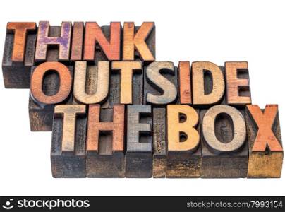 think outside the box - motivational phrase in vintage letterpress wood type, stained by ink, isolated on white