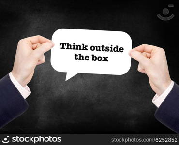 Think outside the box written on a speechbubble