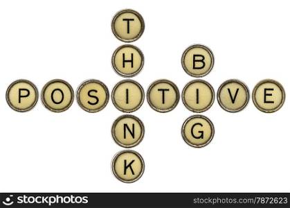 think positive and big crossword in old round typewriter keys isolated on white