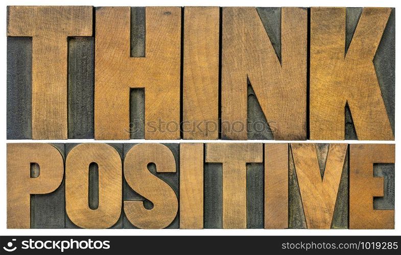 Think positive -isolated word abstract in vintage letterpress wood type blocks, optimism and mindset concept