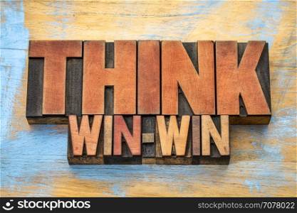 think win-win - word abstract in vintage letterpress wood type blocks against grunge wooden background