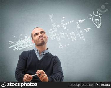 Thinking businessman planning his business structure