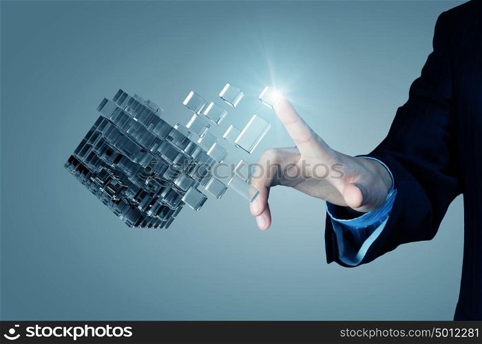 Thinking outside the box as concept. Businessman hand touch cube as symbol of problem solving