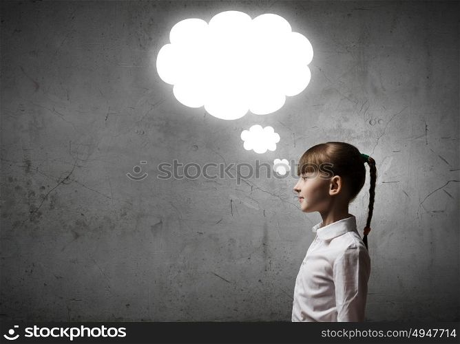 Thinking over something. Girl of school age and speech balloons above her head