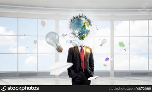 Thinking wide and globally . Businessman with globe instead of head. Elements of this image are furnished by NASA