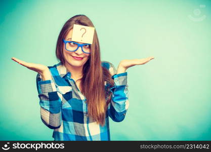 Thinking woman with big nerdy eyeglasses and question mark on forehead. Creating new idea, studying and education concept.. Thinking woman with big eyeglasses and light bulb