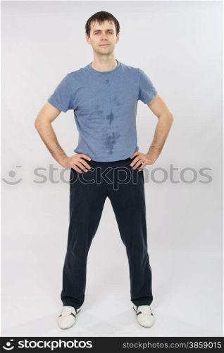 thirty young athletic man does physical exercises. Portrait of an athlete after a workout