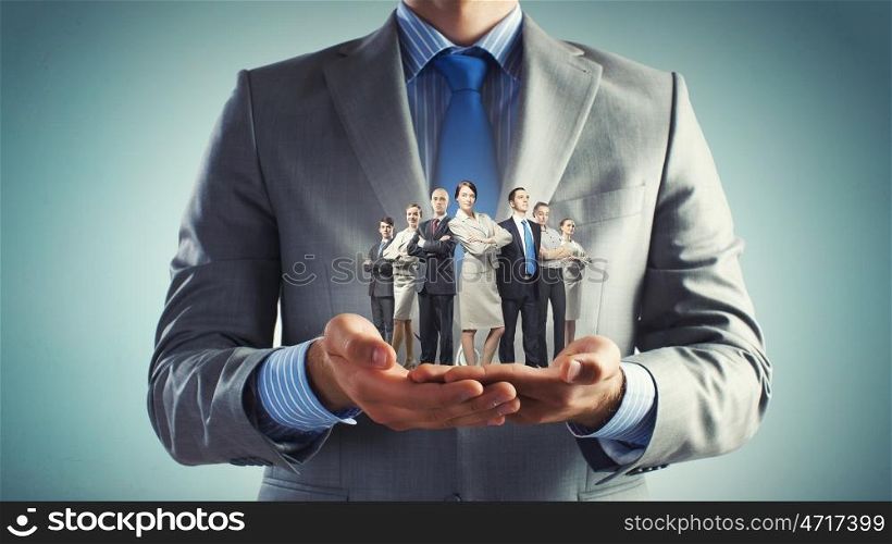 This is my team. Close up of businessman holding in hands successful business team