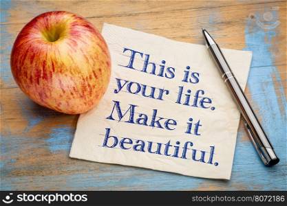This is your life, make it beautiful - handwriting on a napkin with a fresh apple