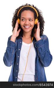 This music is really nice!. Beautiful young african woman listening to music, isolated over white