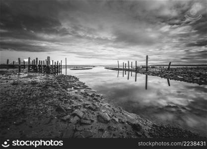This old forgotten harbor is located near the village of Cocksdorp on Texel, in the middle of the UNESCO Wadden Sea area.. Small jetty with harbor along the coastline of the wadden island of Texel