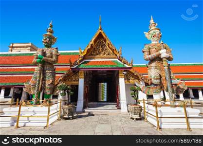 Thotsakhirithon giant demons guarding an exit of Wat Phra Kaew Temple in Bangkok, Thailand