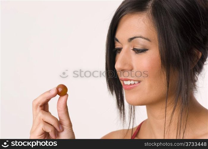 Thought of the Grape Woman Hold Raw Fruit. Beautiful Brunette Eats Grape