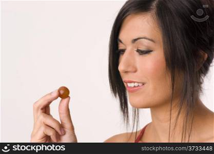 Thought of the Grape Woman Hold Raw Fruit. Beautiful Brunette Eats Grape