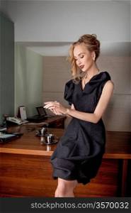 Thoughtful business woman fashion model in modern office indoors