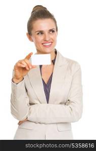 Thoughtful business woman holding business card