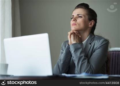 Thoughtful business woman working at desk
