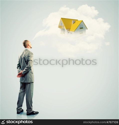 Thoughtful businessman. Image of thoughtful businessman standing with back