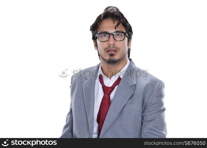 Thoughtful businessman looking away against white background