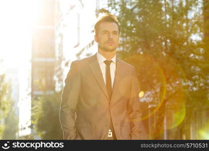 Thoughtful businessman looking away outdoors