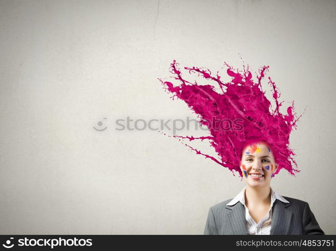 Thoughtful businesswoman with colorful splashes out of his head. Woman with colored head