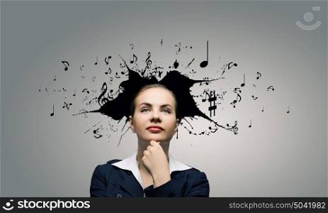 Thoughtful businesswoman with colorful splashes out of his head. Woman with coloured head