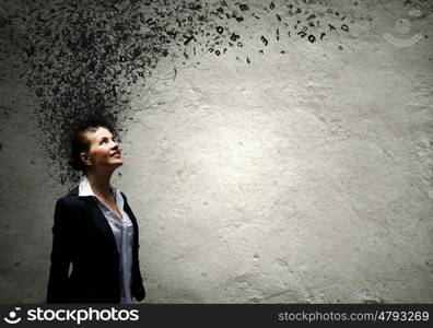 Thoughtful businesswoman. Young attractive businesswoman with thoughts above her head