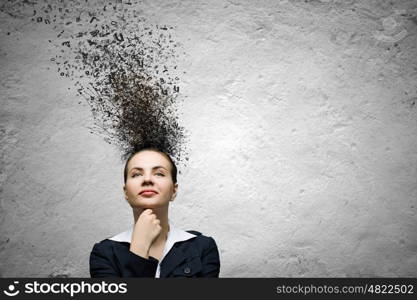 Thoughtful businesswoman. Young attractive businesswoman with thoughts above her head