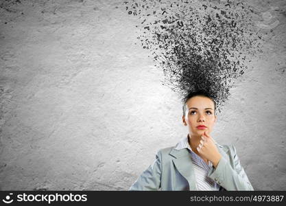 Thoughtful businesswoman. Young attractive businesswoman with thoughts above her head