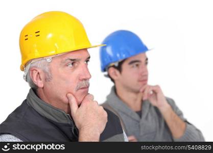 Thoughtful construction workers