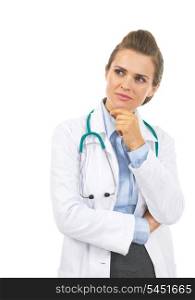 Thoughtful doctor woman looking on copy space