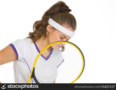 Thoughtful female tennis player holding racket