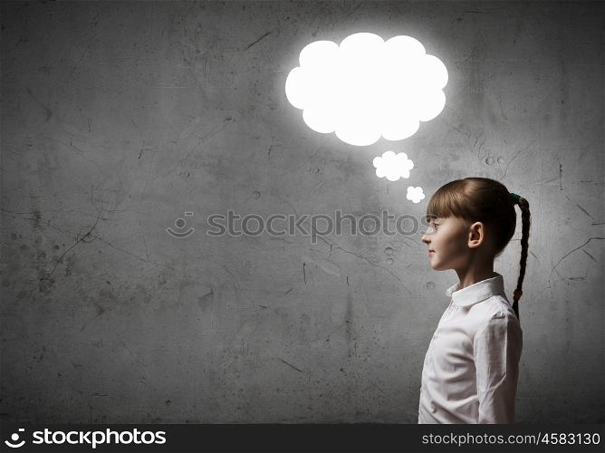 Thoughtful girl. Cute girl of school age and speech bubbles above