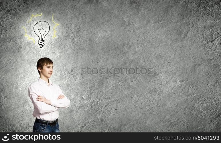 Thoughtful guy. Boy of school age and light bulb. Idea concept