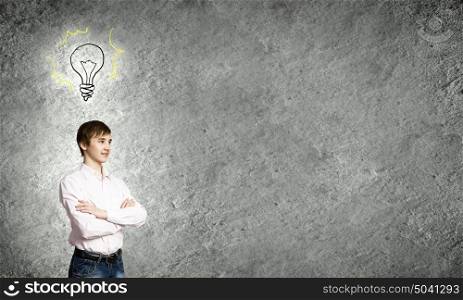 Thoughtful guy. Boy of school age and light bulb. Idea concept