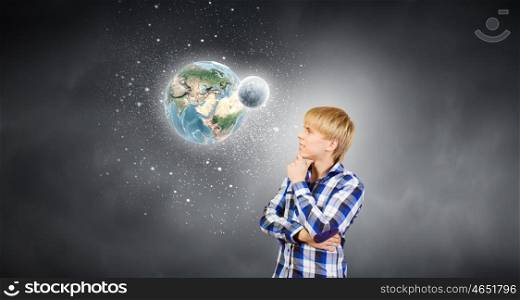 Thoughtful guy. Young handsome man in casual thinking over something. Elements of this image are furnished by NASA